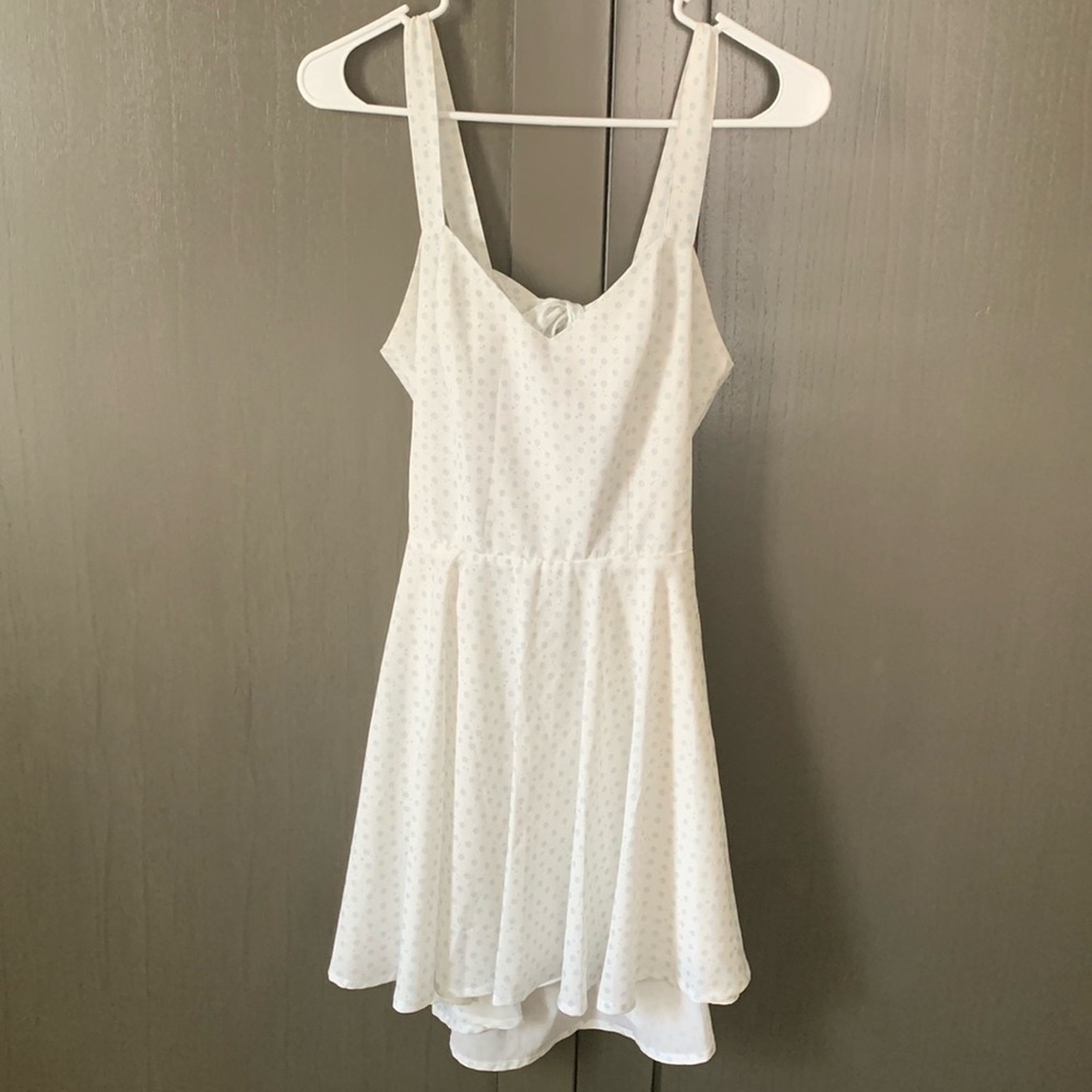 Size small open back mini dress white with blue stars, moons, and flower pattern